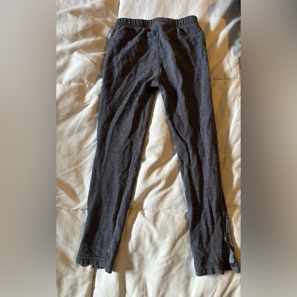 Charcoal gray girls pants with mini zippers by ankles